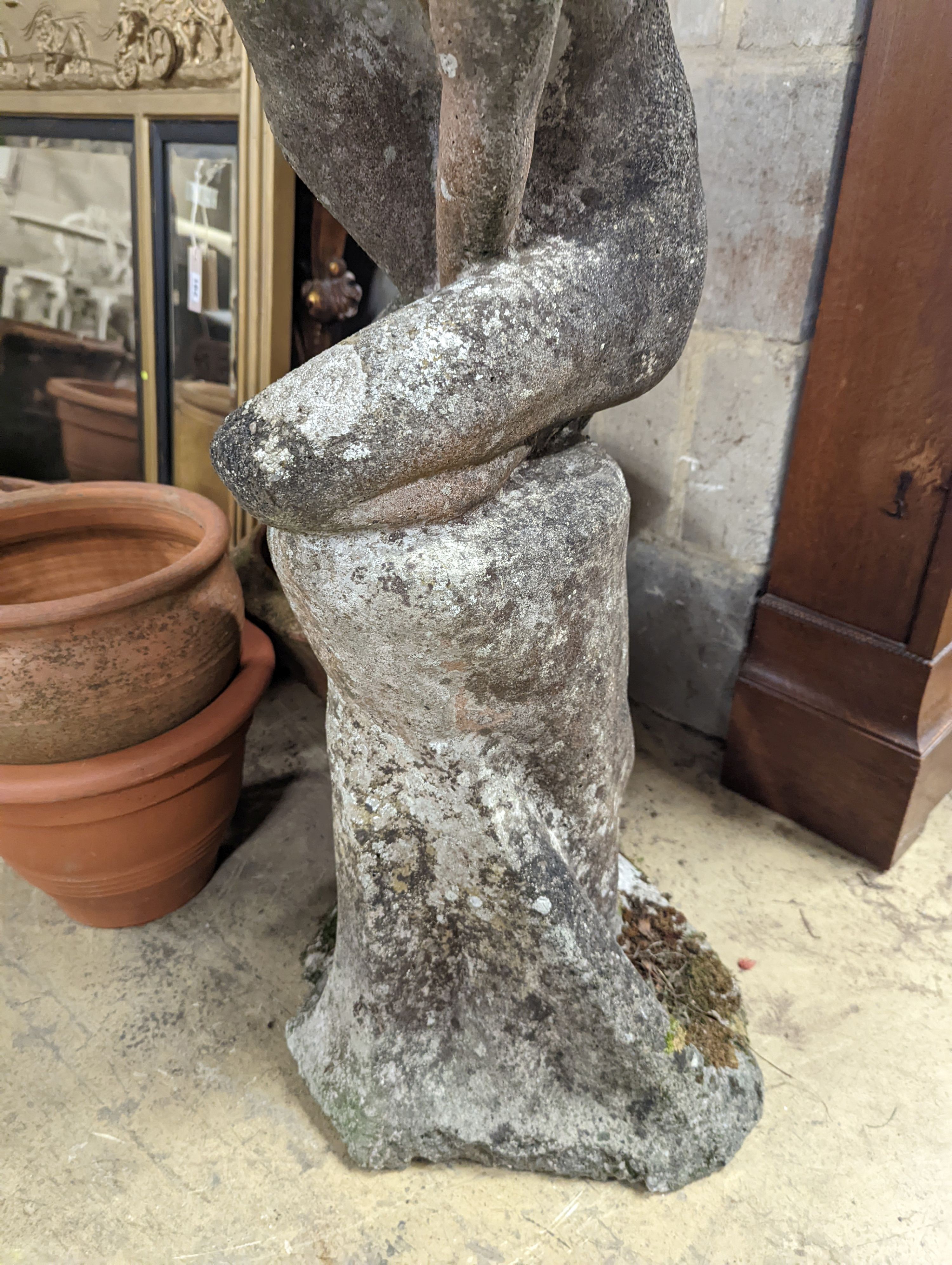 A reconstituted stone garden ornament, child bather, height 94cm